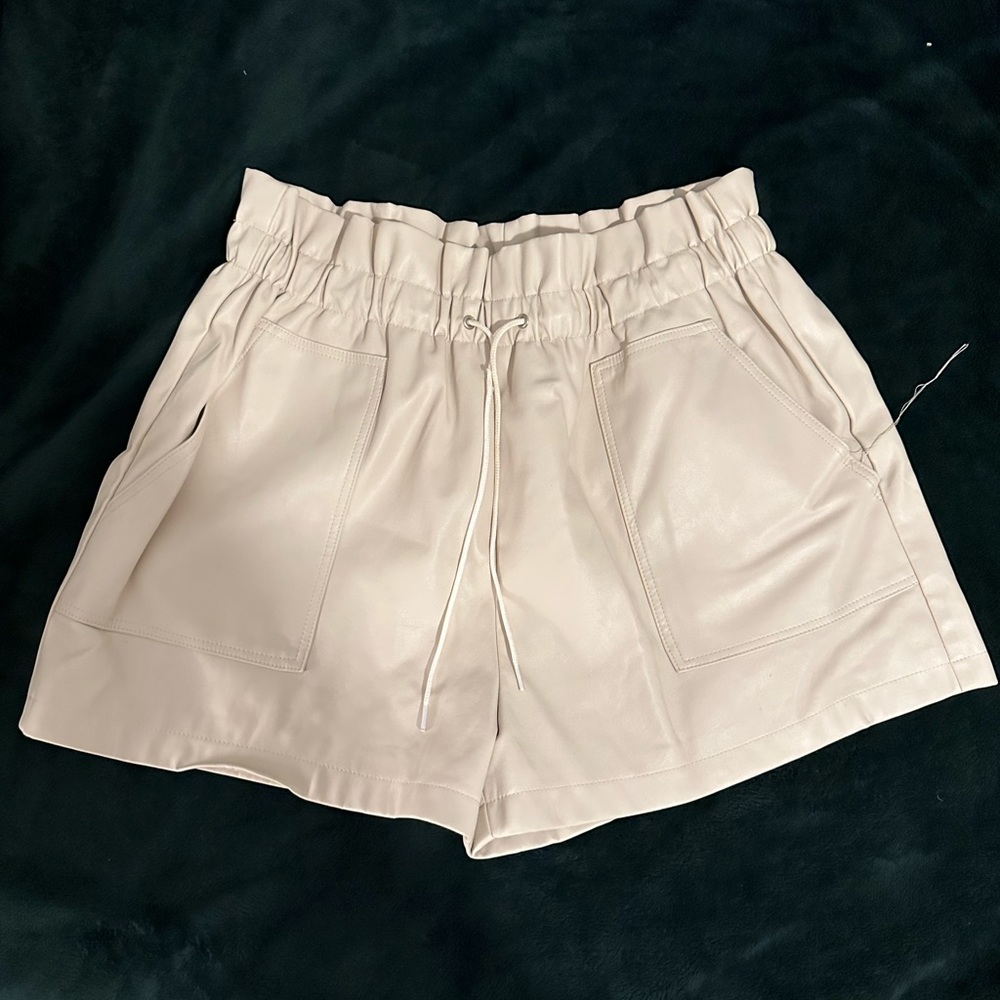 White leather shorts